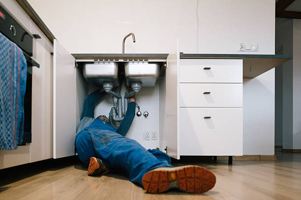 Professional Emergency Plumber technician working in Thompson, CT